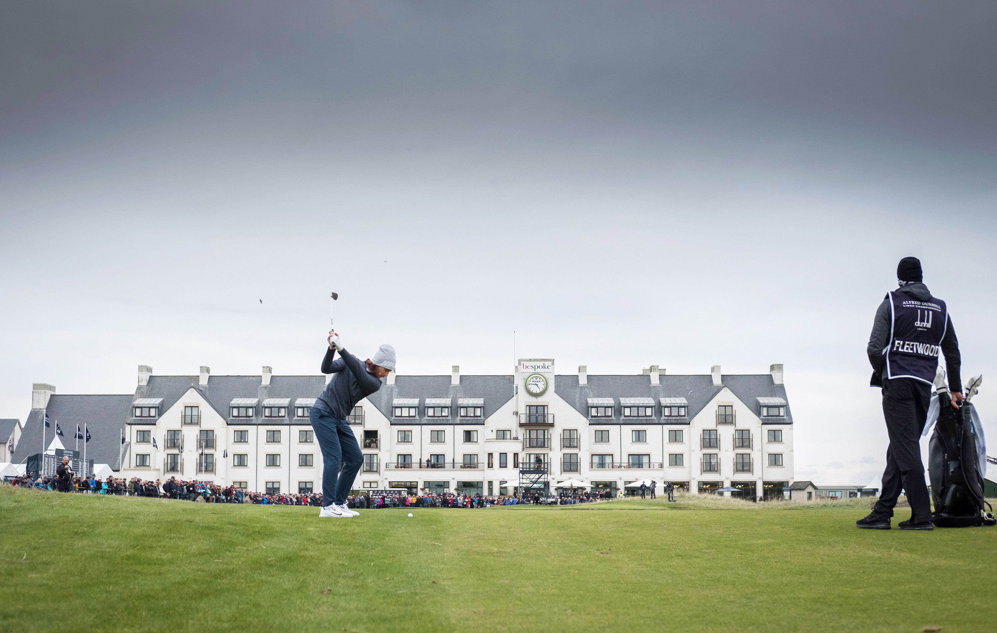 Tommy Fleetwood plays his approach into the 18th hole at Carnoustie during yesterday's record 63.