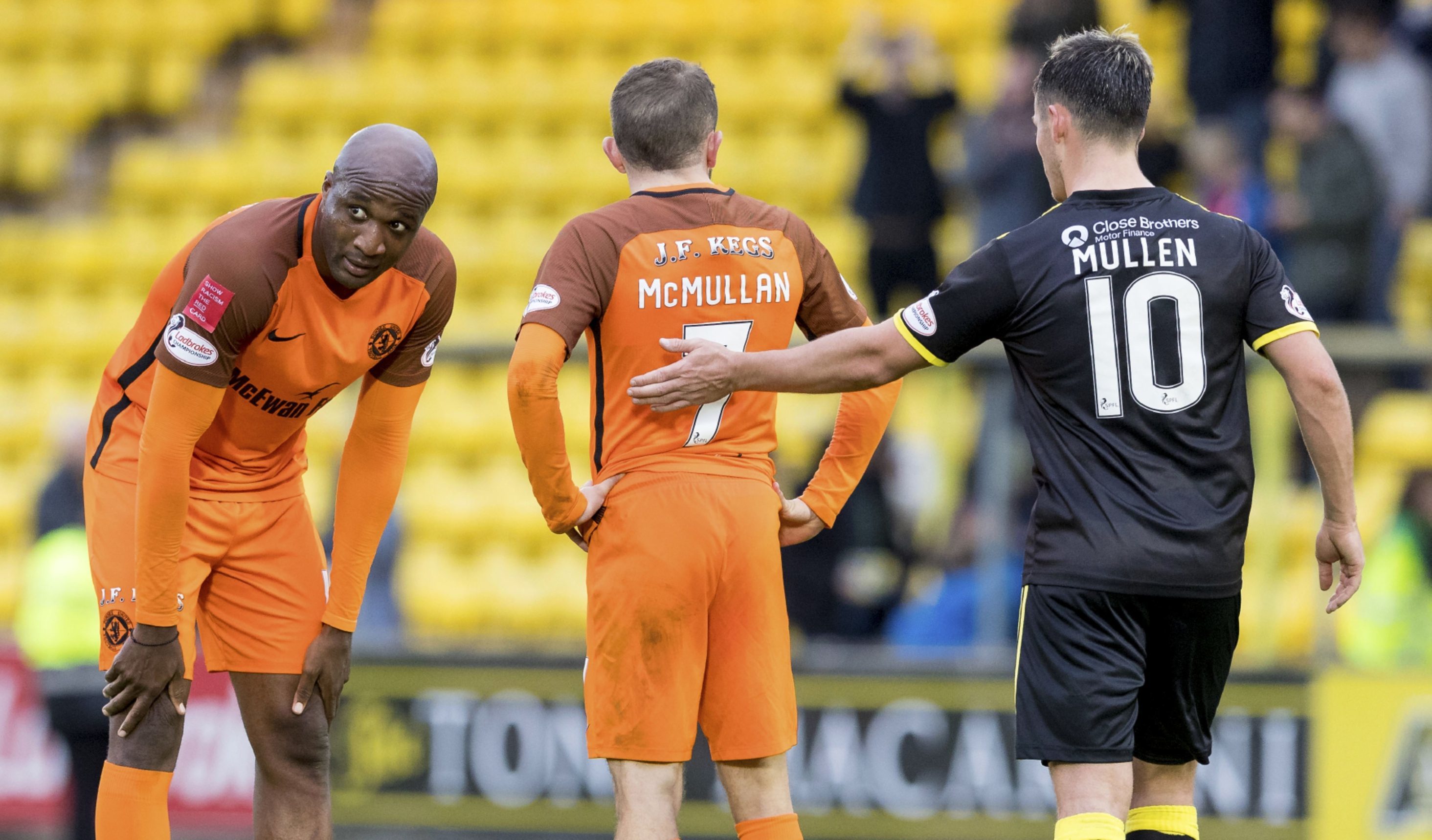 Dejection for United players William Edjenguele and Paul McMullan at full-time on Saturday.