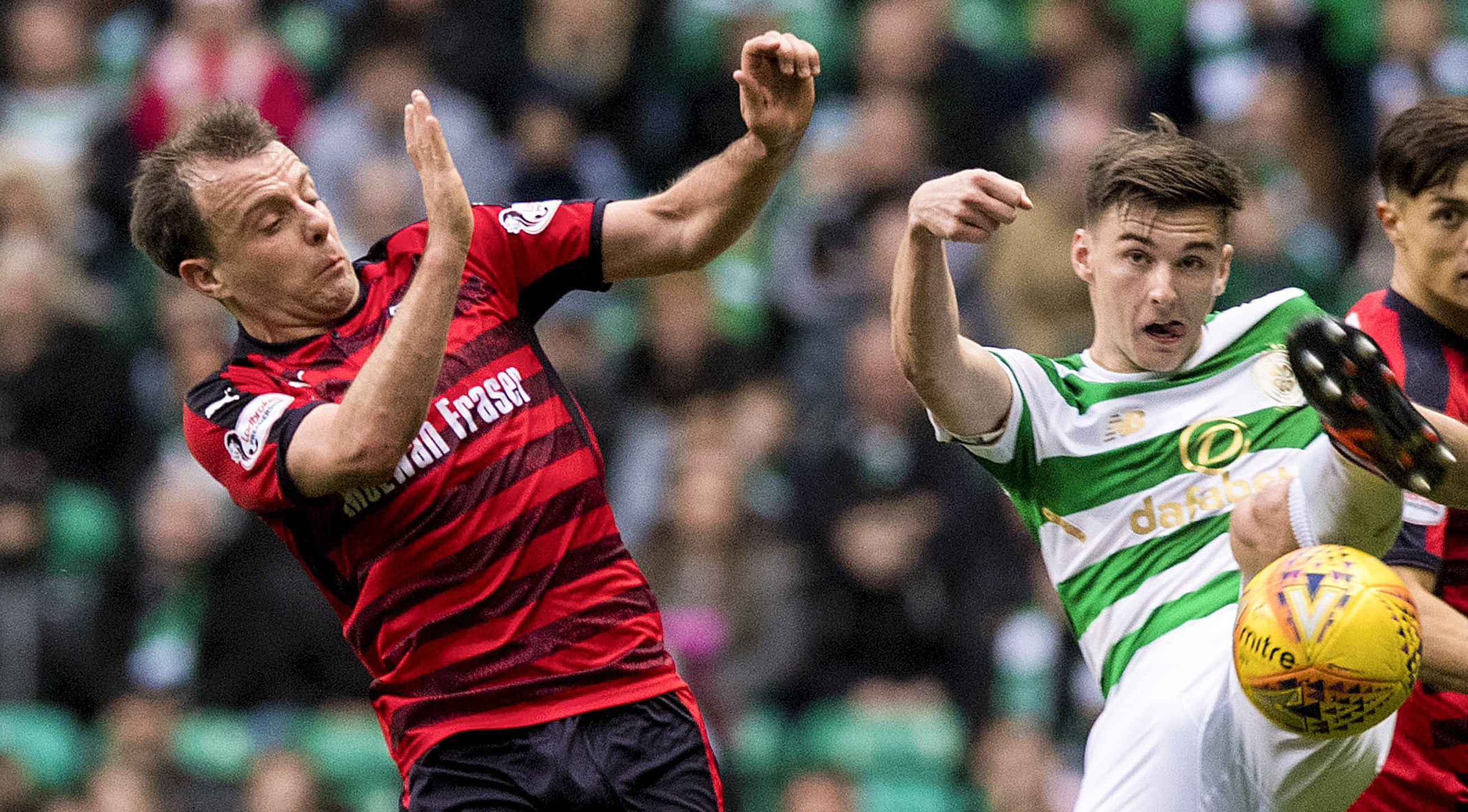 Paul McGowan, left in a tussle for the ball with Kieran Tierney.