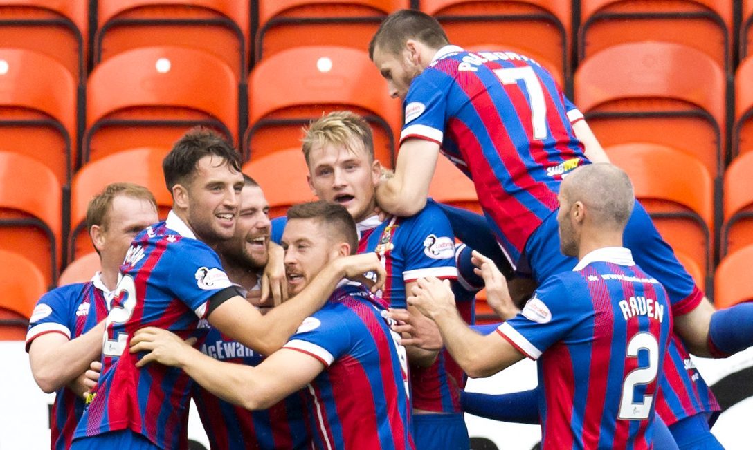 The Inverness players celebrate their opener