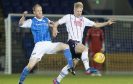 St Johnstone's Steven Anderson (left) competes for the ball with Ross County's Thomas Mikkelsen.