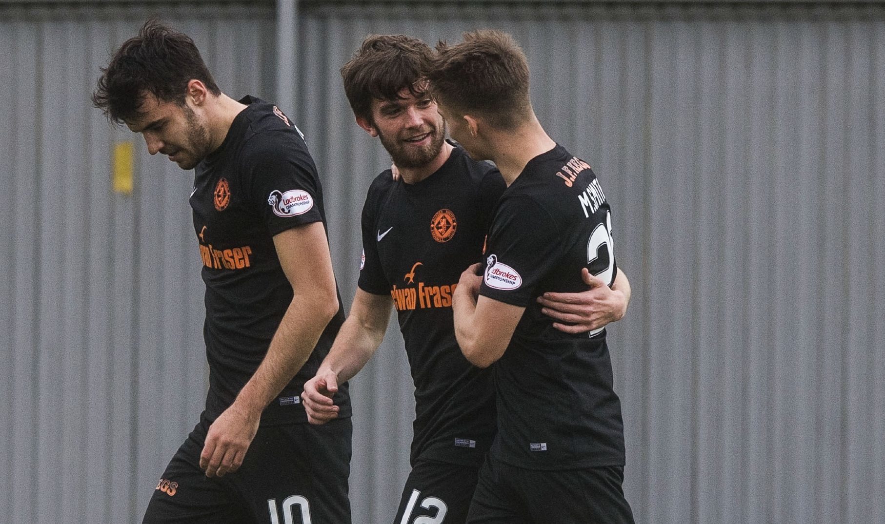 Sam Stanton (centre) is congratulated after opening the scoring.