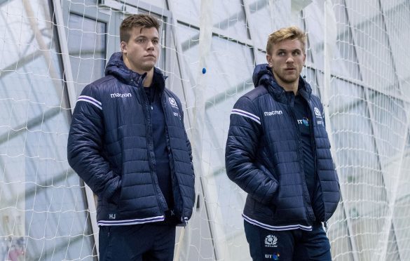 Huw Jones (left) and Scotland newcomer Chris Harris watching training at Oriam yesterday.