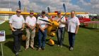Picture at a Light Aircraft Association rally at Sywell Aerodrome in Northamptonshire are (L – R) Alisdair Stewart (Chairman of ASSET), Adrian Lloyd (the LAA inspector who will, subject to satisfactory review “sign off” the Build-a-Plane kit assembly), Roger Cornwell and Steve Williams (Eurofox UK) and Neil Watt (ASK Flying Club investor). The yellow aircraft is a Eurofox like that Kinross High will build.