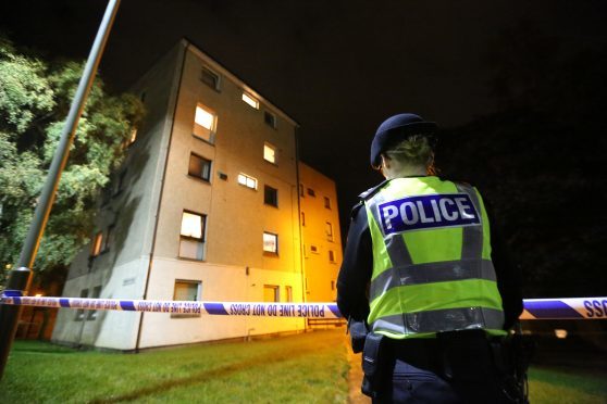 Police outside the flat in Nursery Road on the night of the incident.