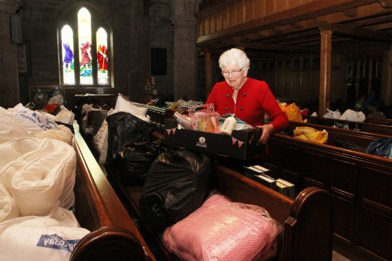 Irene Gillies with some of the donations at Brechin cathedral