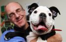 Veterinary surgeon Alan Hill with bulldog Bella.