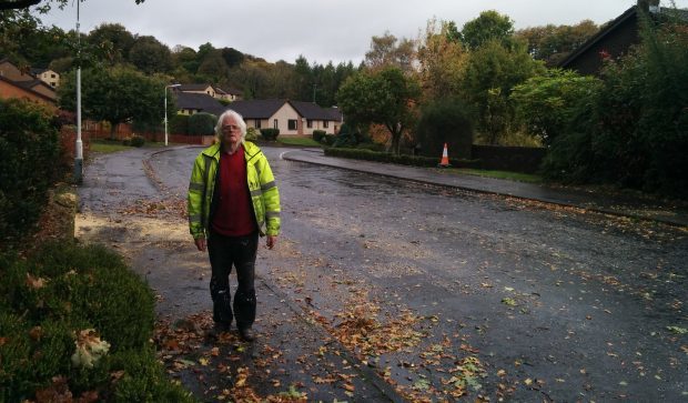 Tom Rush next to the road in Dunvegan Avenue.