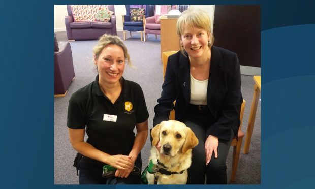Shona Robison, right, meeting Fiona Corner and Uno from the Dementia Dogs Project.