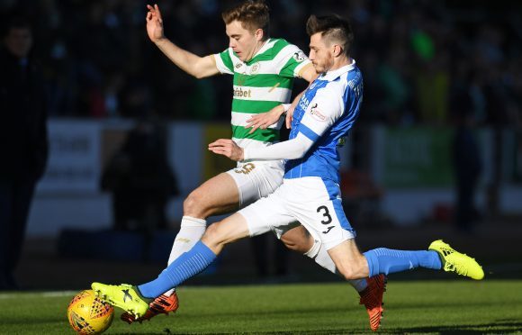 Scott Tanser closes down James Forrest.