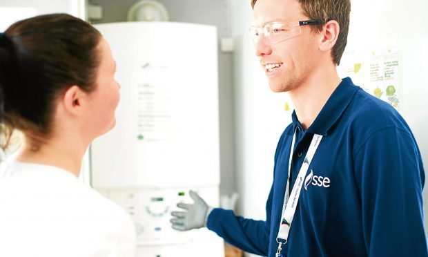 An SSE home engineer talks with a customer