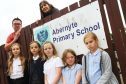 Abernyte Primary School is one of the schools that could close under the council's estates review. Parents think it has been deliberately undermined by the council. 
Picture shows; Chairman and Treasurer of the Parents Council Gerard McGoldrick and Claudia Lacoux with front l to r, Elle Lacoux, 10, Lucy MacGregor, 8, Anna McGoldrick, 9, Bea Meldrum, 9, Maya King, 9.