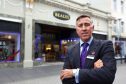 Tony Brown, CEO of Beales, outside the new look store