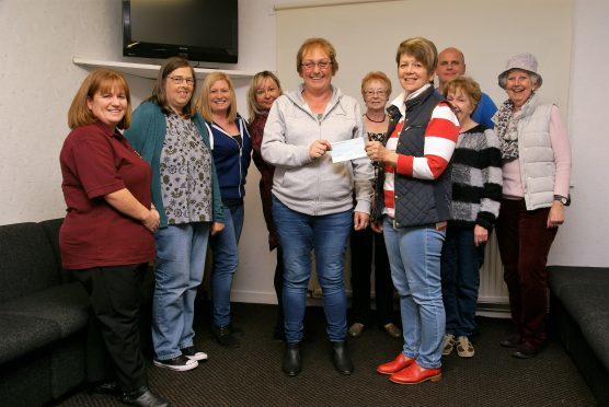 Members of Borrowfield Community Group present their donation to ‘Save a Life Montrose’.