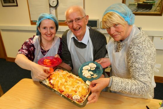 Maureen McGinlay and Helen Penman of Kirrie Cooking Connections with Chris Bennett (84) from Kirrie who came along and made a pizza.