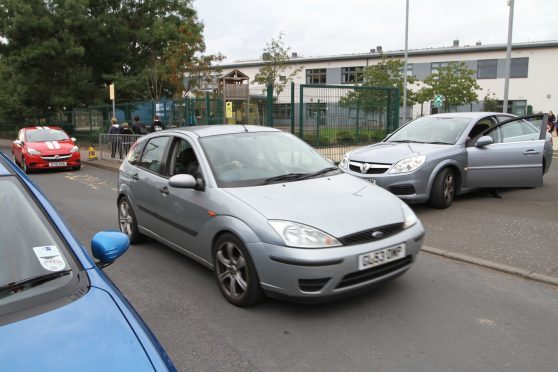Traffic congestion around Fintry Primary School. The drivers of the cars pictured were not the "aggressive" parents mentioned in the article.