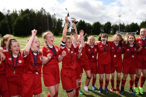 Jeanfield Swifts U15 girls celebrate this year's league cup final win. Photograph: Stuart Cowper.