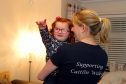 Courier Kirriemuir News- 3 year old Caitlin Wilkie from kirriemuir who suffers from Bardet-Biedl Syndrome,with the family embarking on a series of fundraising events next year,picture shows; Caitlin at home with her mum Ashley (38),wednesady 22nd november.