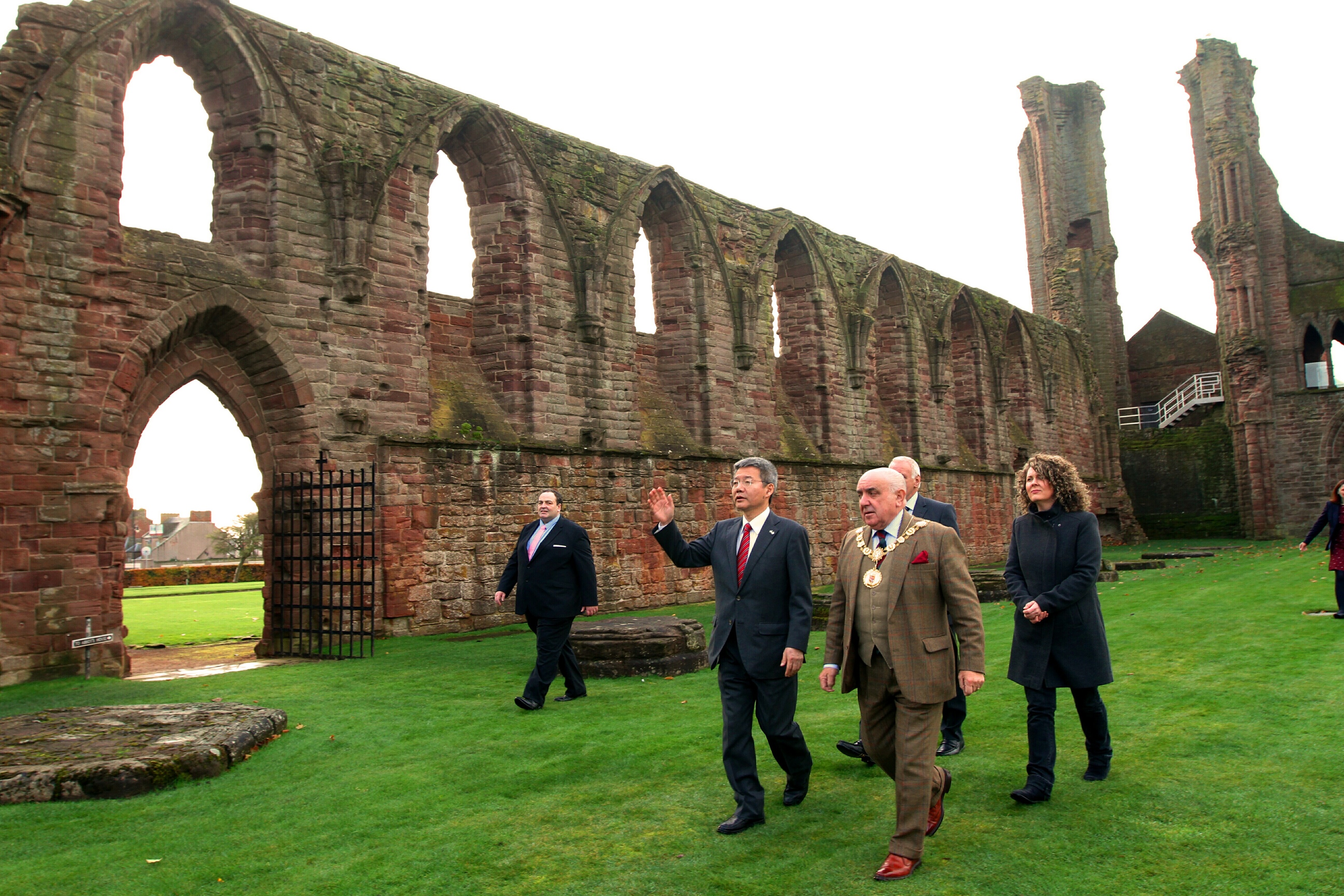 Courier Arbroath News- Japanese Consul General Daisuke Matsunaga visits Arbroath Abbey,picture shows; with Provost Proctor & steward Andrew Kennedy,dressed as a Benedictine Monk, who was showing them around,tuesday 14th november.