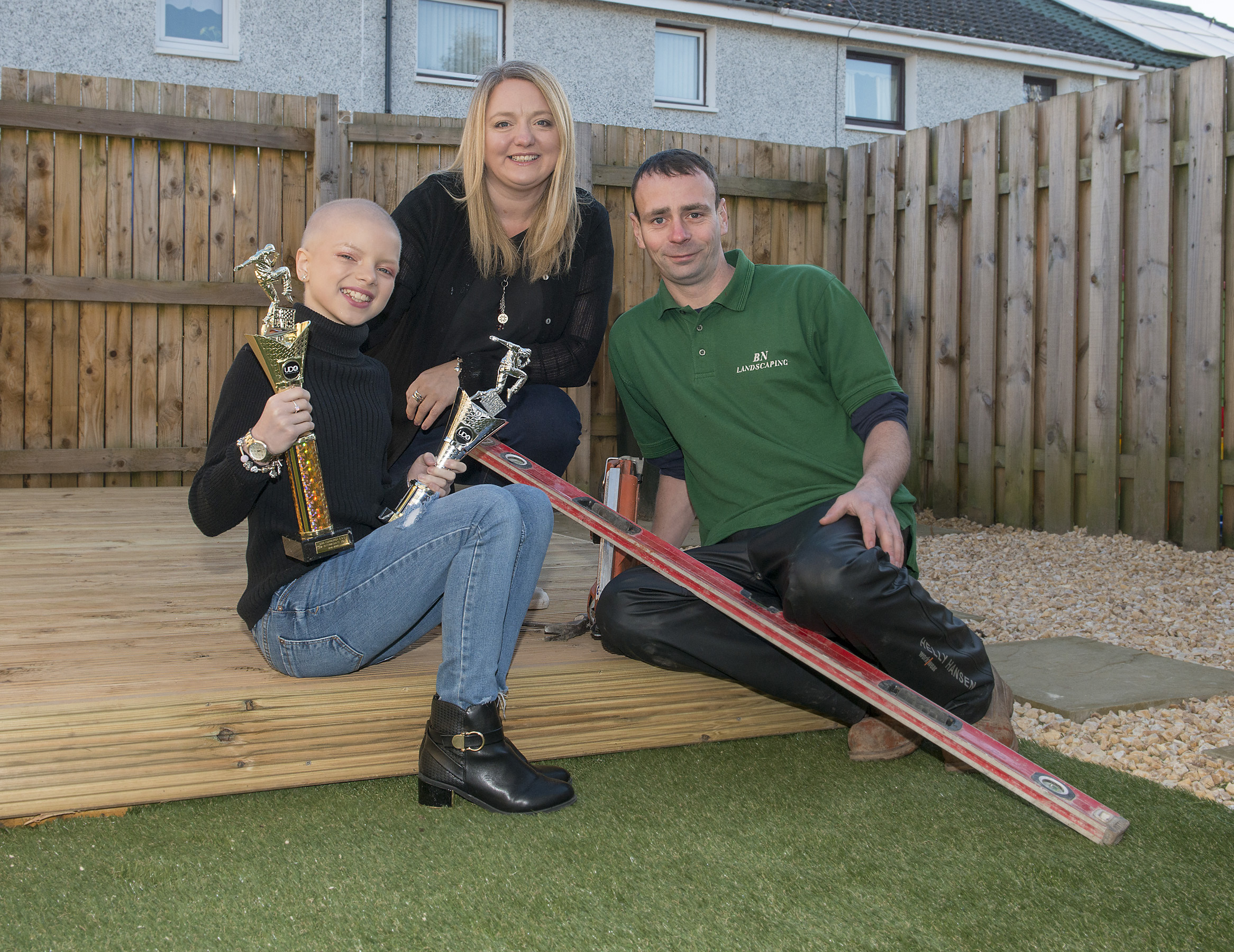 Lily with her mum Jane Douglas and garden contractor Bobby Netherington.