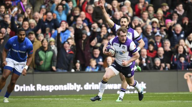 Stuart Hogg runs clear to score the opening try at Murrayfield on Saturday.