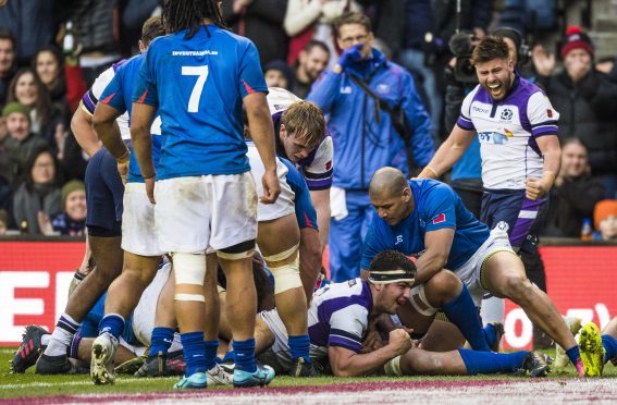 Scotland's Stuart McInally celebrates scoring his second and his side's fourth try of the game.