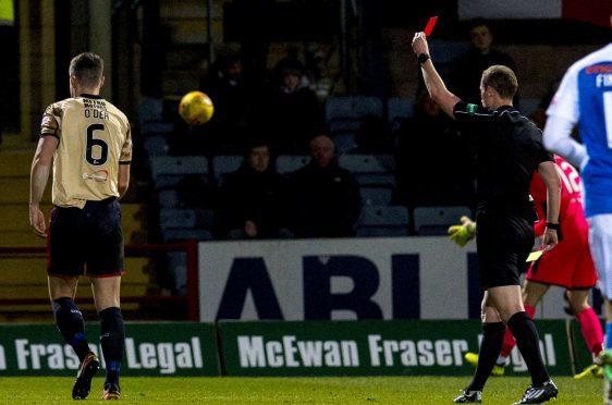 Darren O'Dea is shown a red card by referee Willie Collum.