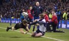 Stuart Hogg just can't get his pass inside to Byron McGuigan in the thrilling finale to Saturday's Autumn Test against New Zealand.