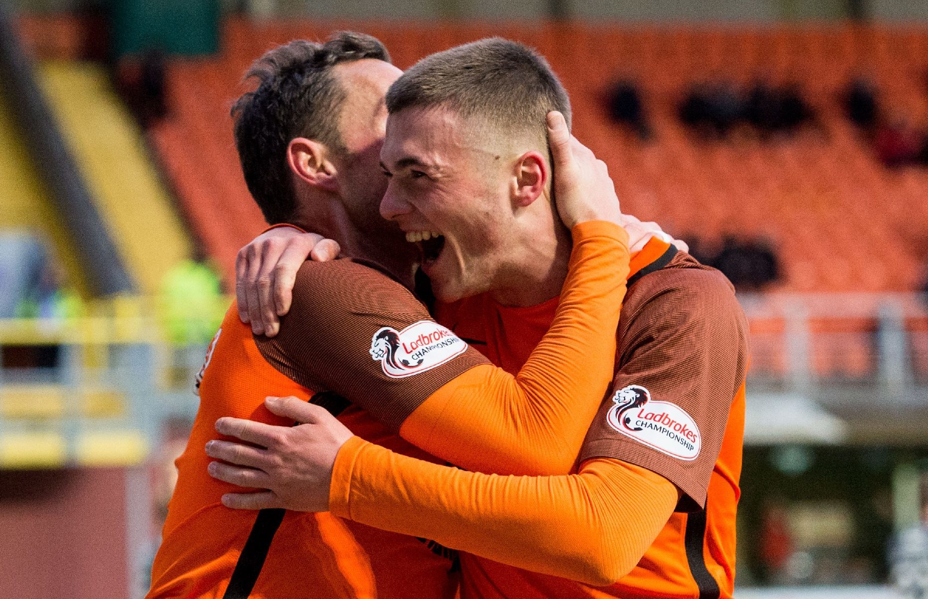 Jamie Robson is congratulated by Scott McDonald after his goal.