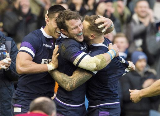 Peter Horne congratulates Byron McGuigan after his opening try against Australia.