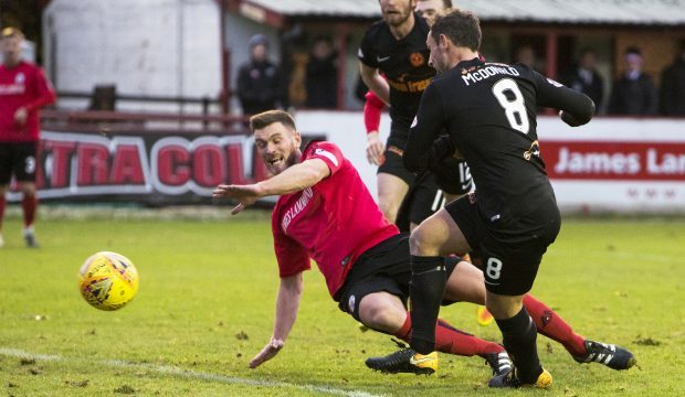 Scott McDonald opens the scoring for Dundee United.