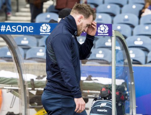 Stuart Hogg leaves the pitch after injuring himself in the warm-up prior to Saturday's win over Australia.