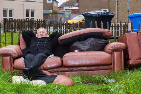 Councillor John O'Brien is trying to get Fife Council to uplift unsightly couches and other dumped in peoples gardens.