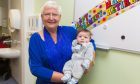 Joan Taylor was joined at an event to celebrate her retiral by her mums and babies, including eight-week-old Jack Fotheringham