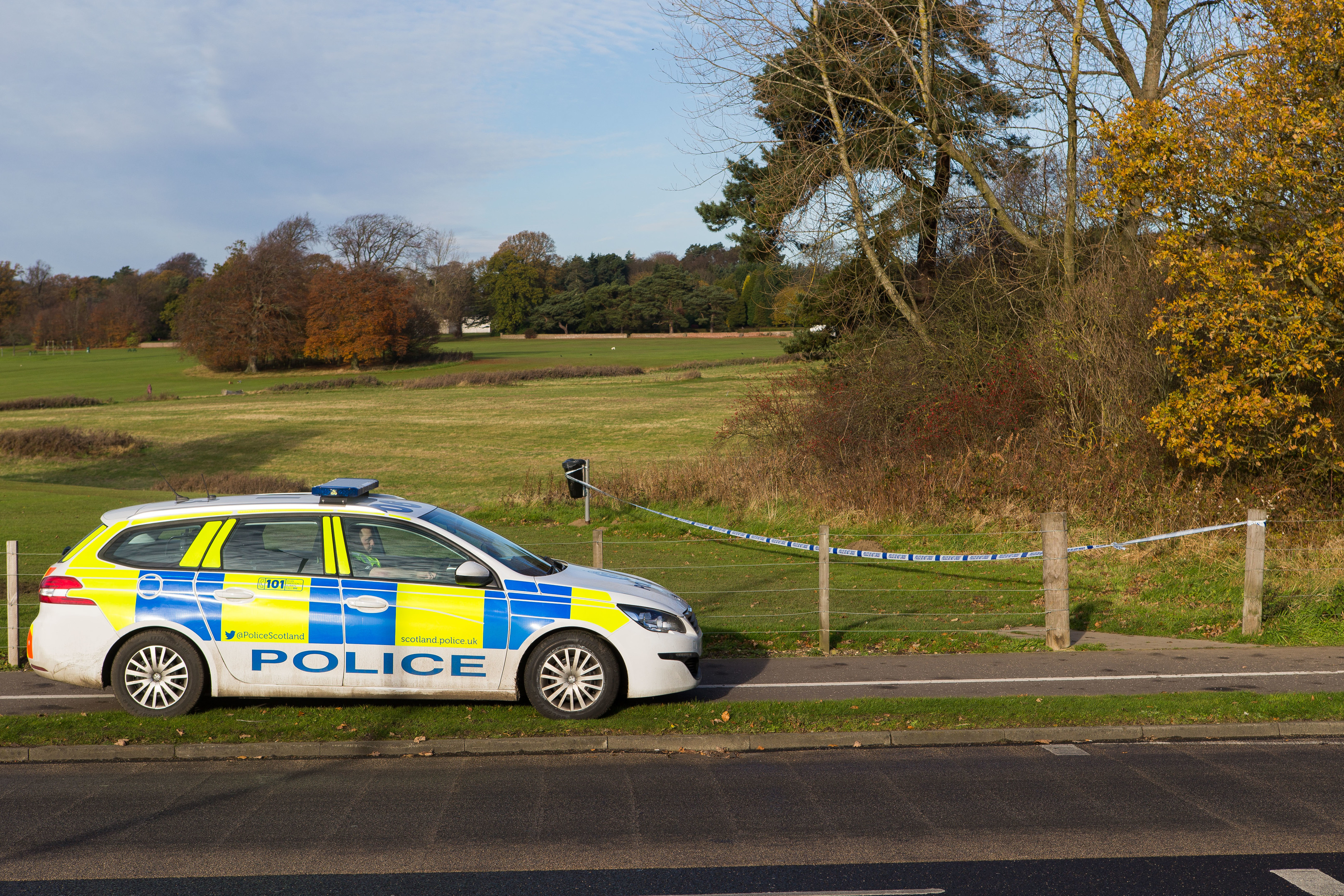 Police posted outside an area of Dunnikier Park with section of woodland taped off.
