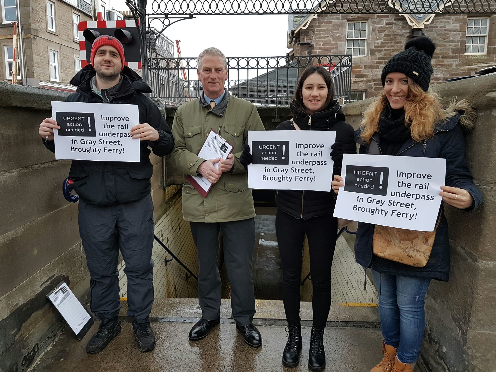 Kieran Thomson, Craig Duncan, Paula Gomila Marques and Federica Di Giovenale protesting outside the underpass in February.