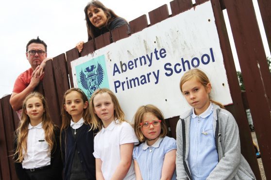 Chairman and Treasurer of the Parents Council Gerard McGoldrick and Claudia Lacoux with front l to r, Elle Lacoux, 10, Lucy MacGregor, 8, Anna McGoldrick, 9, Bea Meldrum, 9, Maya King, 9.