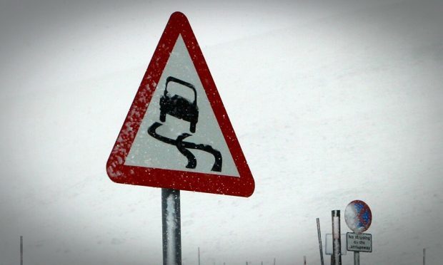 A man walks through the snow in Killin on Sunday, December 27.