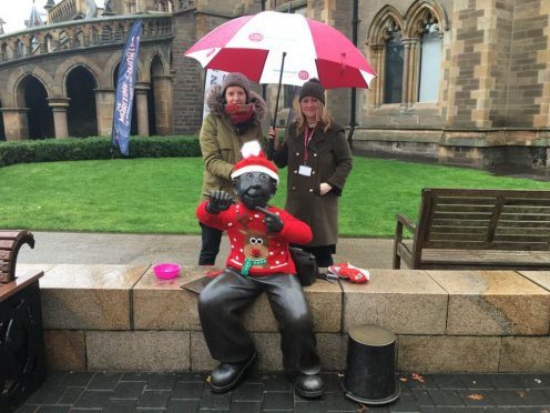 Kim Galligan and Cheryl McDermid, from Mcmanus's learning and engagement team, with the festively-dressed Oor Wullie,