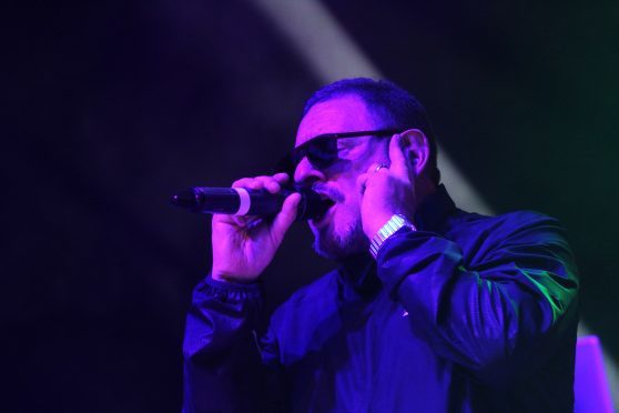 Shaun William Ryder on stage at the Caird Hall.