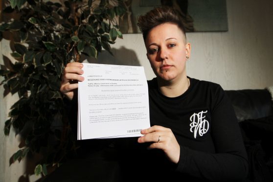 Kellie Livingston, 30  with the speeding ticket she received (Pics by Mhairi Edwards)