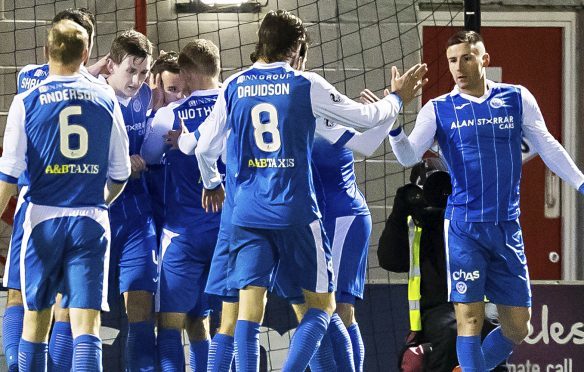 Saints celebrate the winning goal.