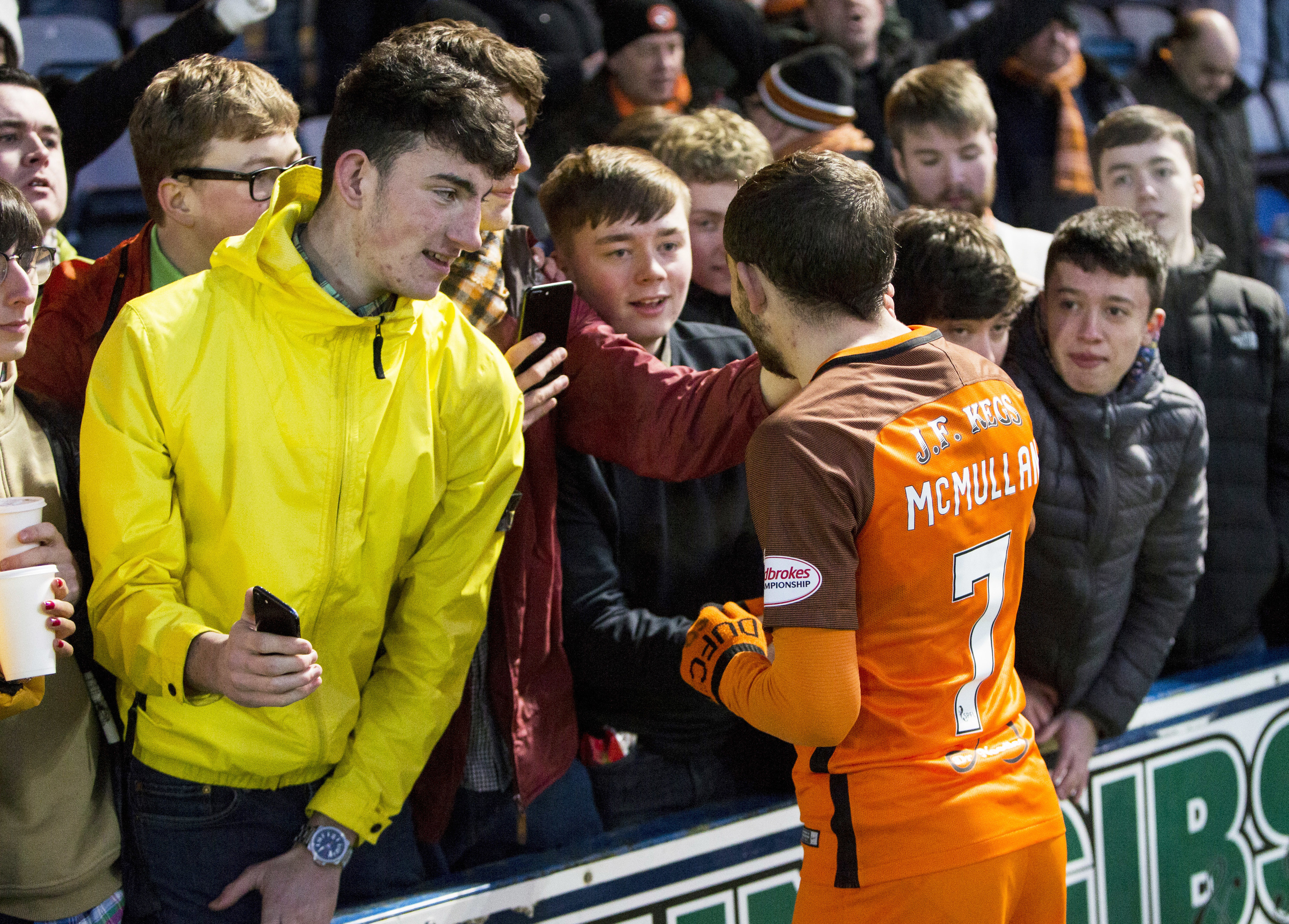 Dundee United's Paul McMullan speaks to the fans after the match is abandoned.