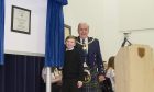 Deputy provost Colin Brown unveiling a plaque with first year pupil Stephen Langdon.
