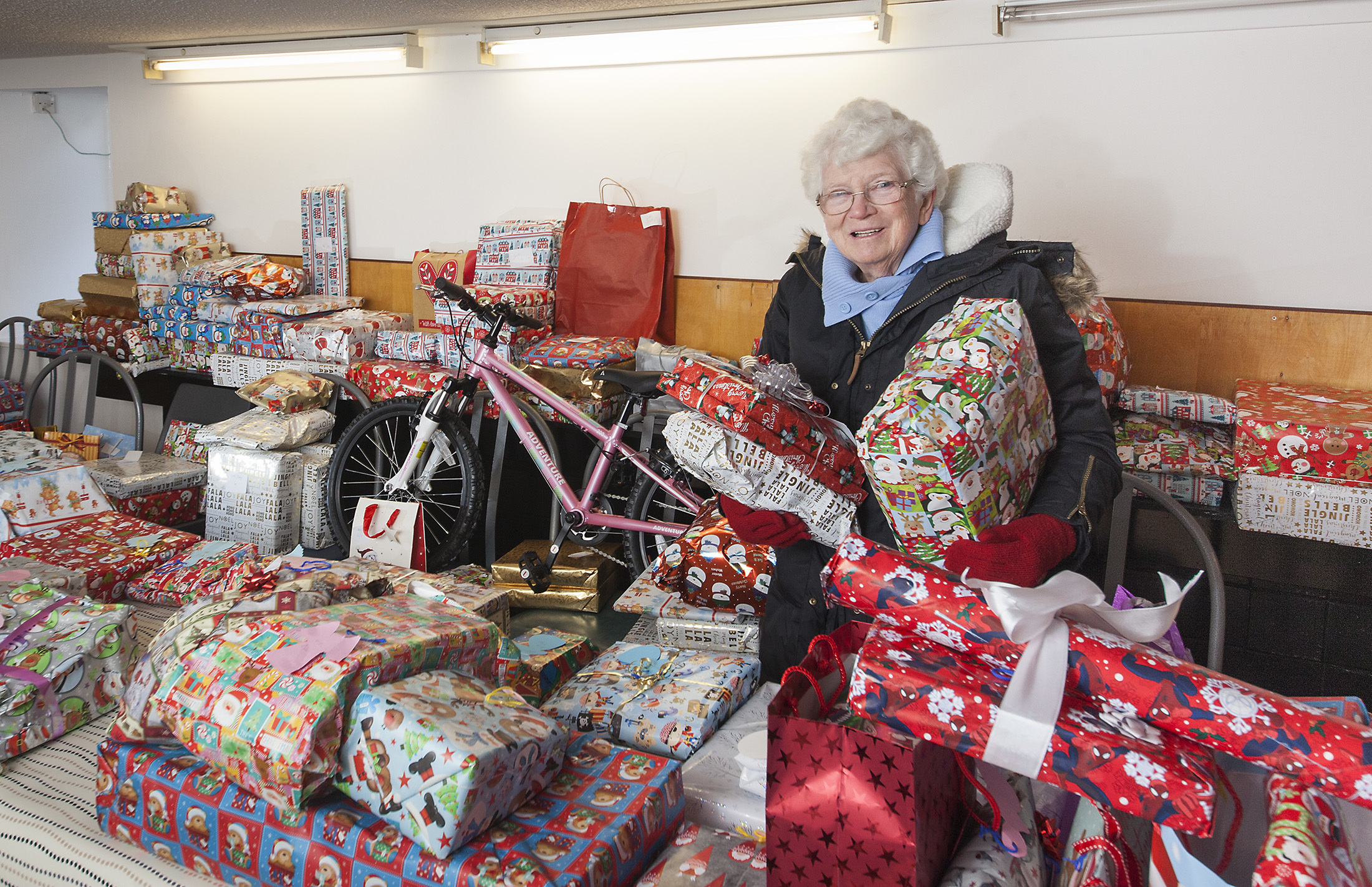Irene Gillies with the presents that have been donated.