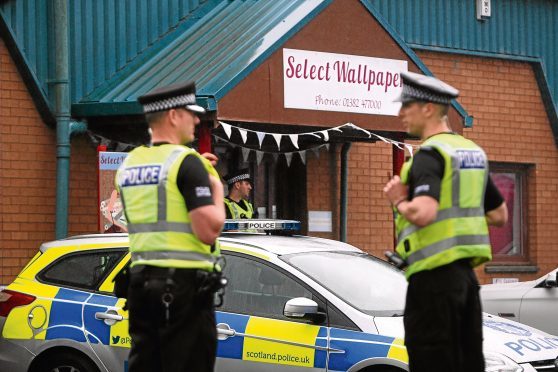 Police officers and vehicles in West Pitkerro Industrial estate on Wednesday, August 2.