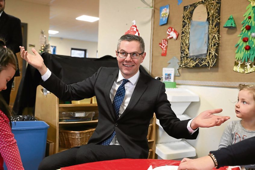 Finance Secretary Derek Mackay, pictured meeting nursery staff and children at Lennoxtown Nursery in Lennoxtown, East Dunbartonshire.