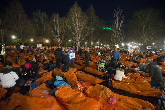 People taking part in Sleep in the Park in Princes Street Gardens.