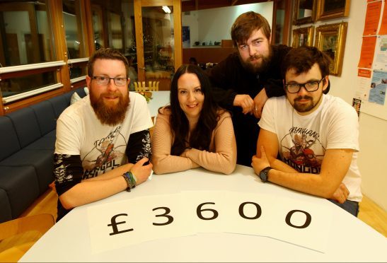 Left to right,  Scott Lauder, Charlene Duncan, fundraising manager at Maggie's Dundee, Euan Simpson and Alan Mann.