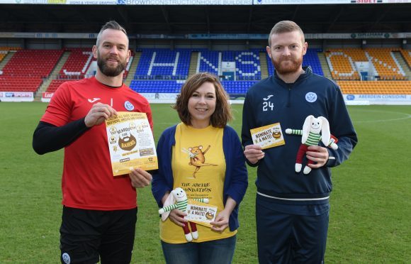 St Johnstone players Alan Mannus and Brian Easton with Emma White, The ARCHIE Foundation head of fundraising.